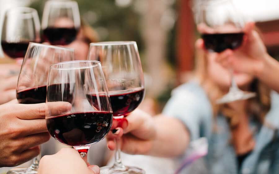 Friends raising glasses of Monapilla Shiraz